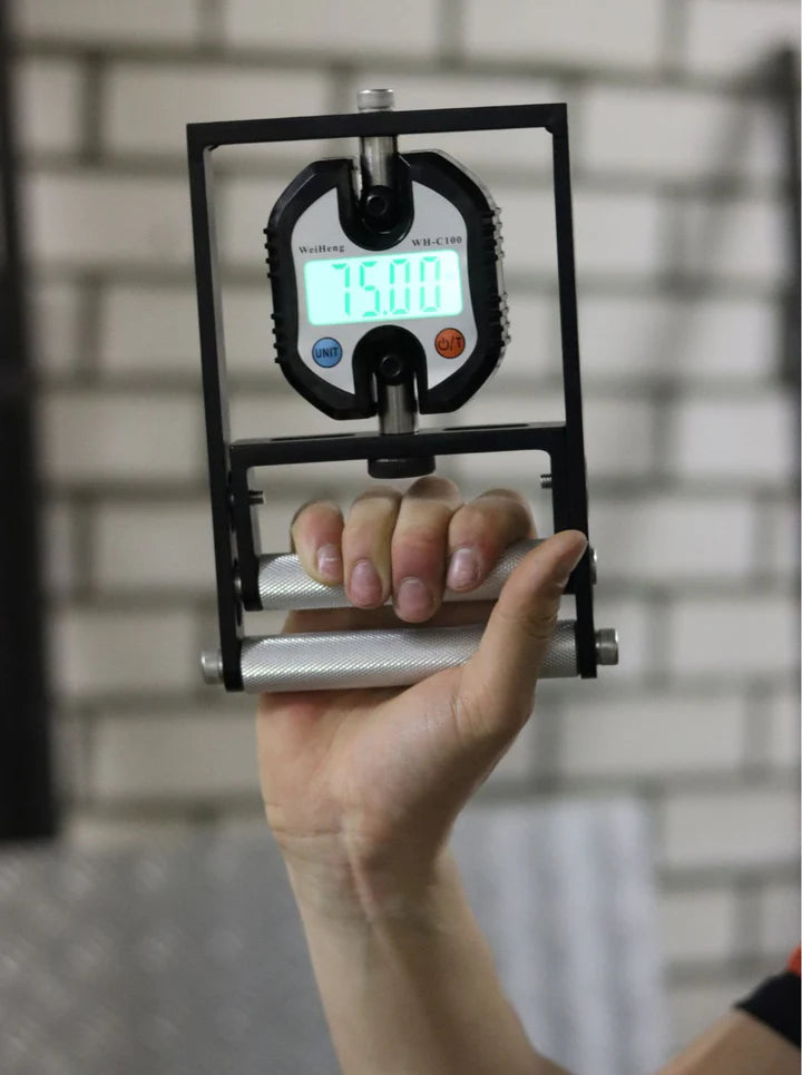 
                      
                        Hand Dynamometer - precise grip strength measuring tool displaying strength in KG or LBS.
                      
                    